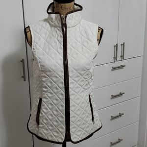 White vest with brown trim